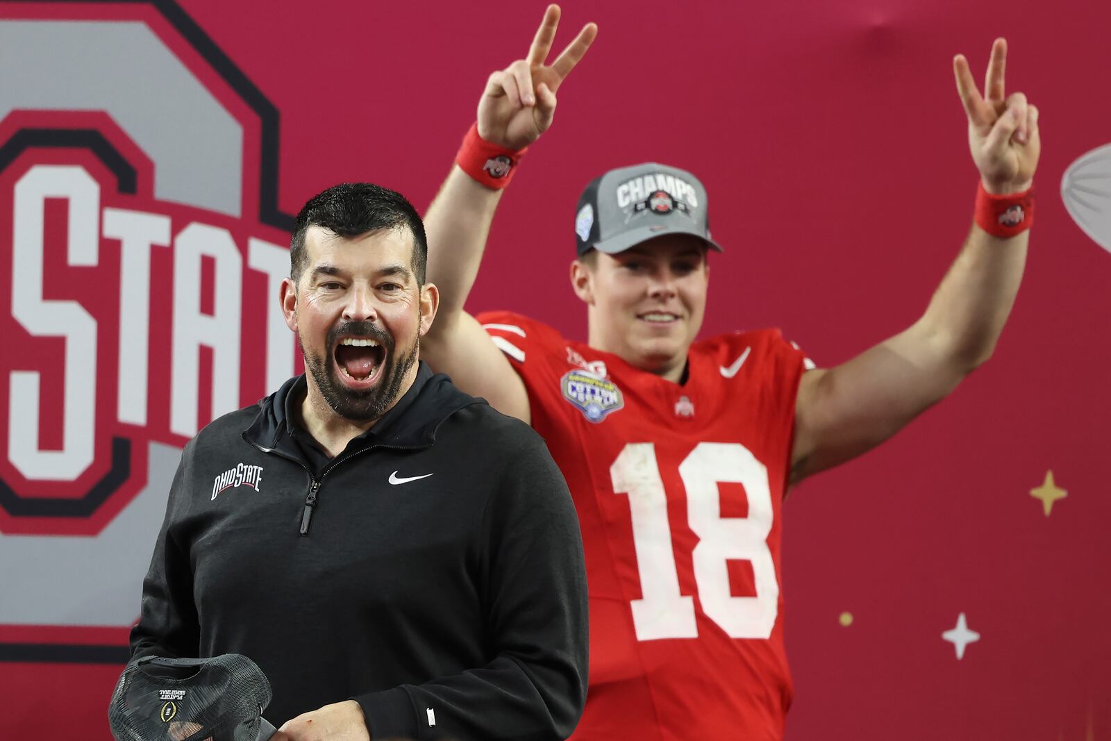 Ohio State head coach Ryan Day, left, and quarterback Will Howard (18) celebrate after the Cotton Bowl College Football Playoff semifinal game against Texas, Friday, Jan. 10, 2025, in Arlington, Texas. (AP Photo/Gareth Patterson)