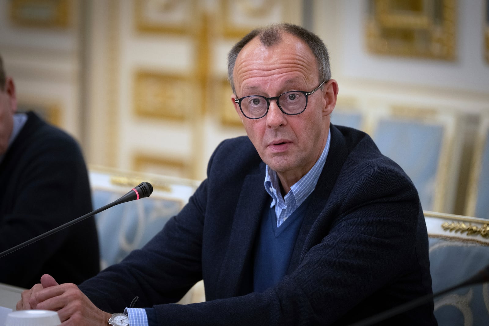 The Chairman of the German Christian Democratic Party (CDU) Friedrich Merz talks during his meeting with Ukrainian President Volodymyr Zelenskyy in Kyiv, Ukraine, Monday, Dec. 9, 2024. (AP Photo/Efrem Lukatsky).