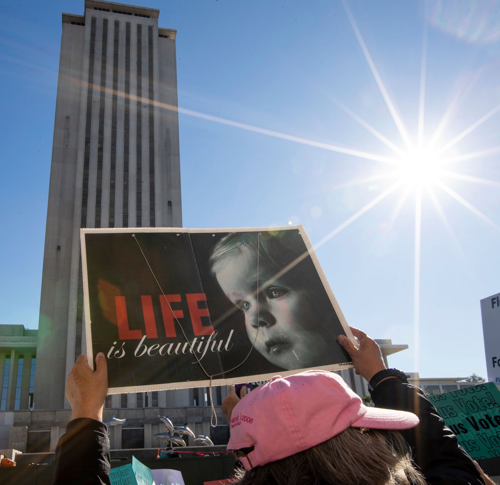 An anti-abortion protester holds a sign while standing outside the Florida Supreme Court after the Court heard arguments on the proposed abortion amendment, Feb. 7, 2024 in Tallahassee, Fla. (Alicia Devine/Tallahassee Democrat via AP, file)