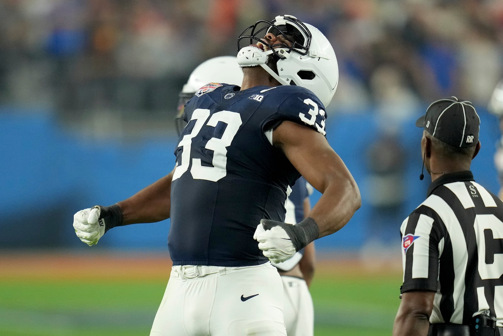 Penn State defensive end Dani Dennis-Sutton (33) celebrates a defensive stop against Boise State during the first half of the Fiesta Bowl College Football Playoff game, Tuesday, Dec. 31, 2024, in Glendale, Ariz. (AP Photo/Ross D. Franklin)