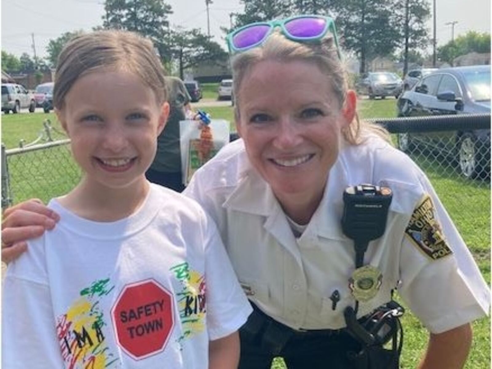 Eleni Frederick, 8, a third grader at St. Joseph Consolidated School in Hamilton, enjoyed her time at this year's 'Safety Town,' operated by Officer Kristy Collins, right. PROVIDED