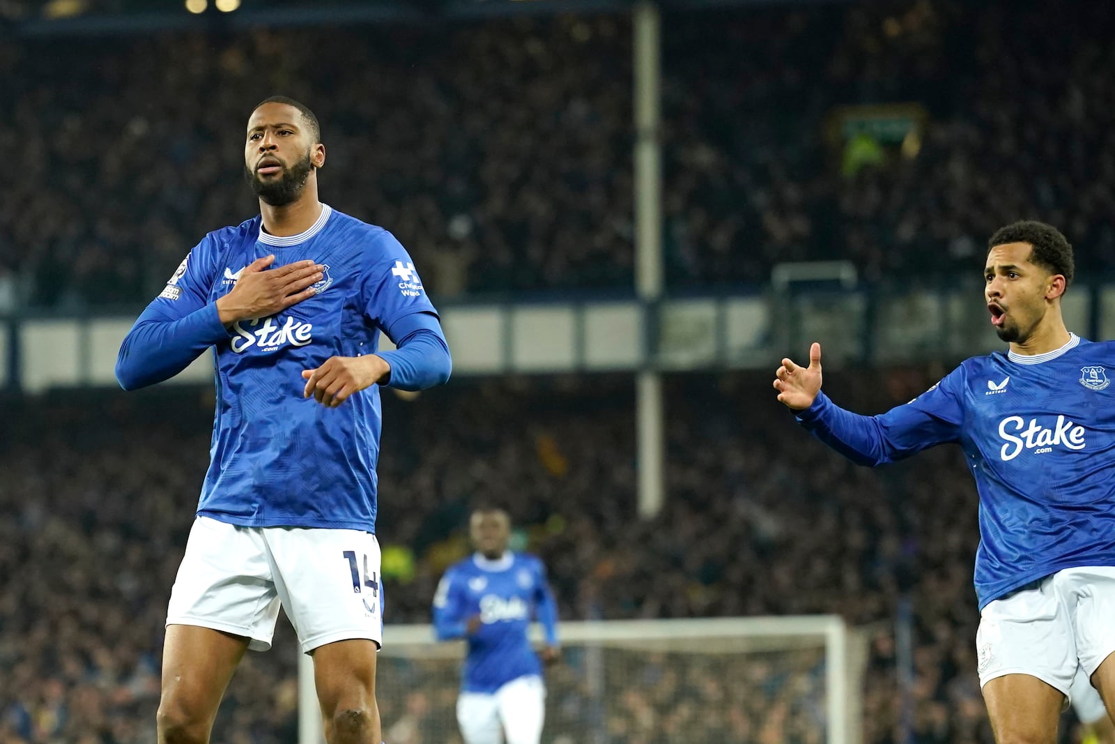 Everton's Beto, left, celebrates with teammates after scoring his side's opening goal during the English Premier League soccer match between Everton and Liverpool, Liverpool, England, Wednesday, Feb.12, 2025. (AP Photo/Dave Thompson)