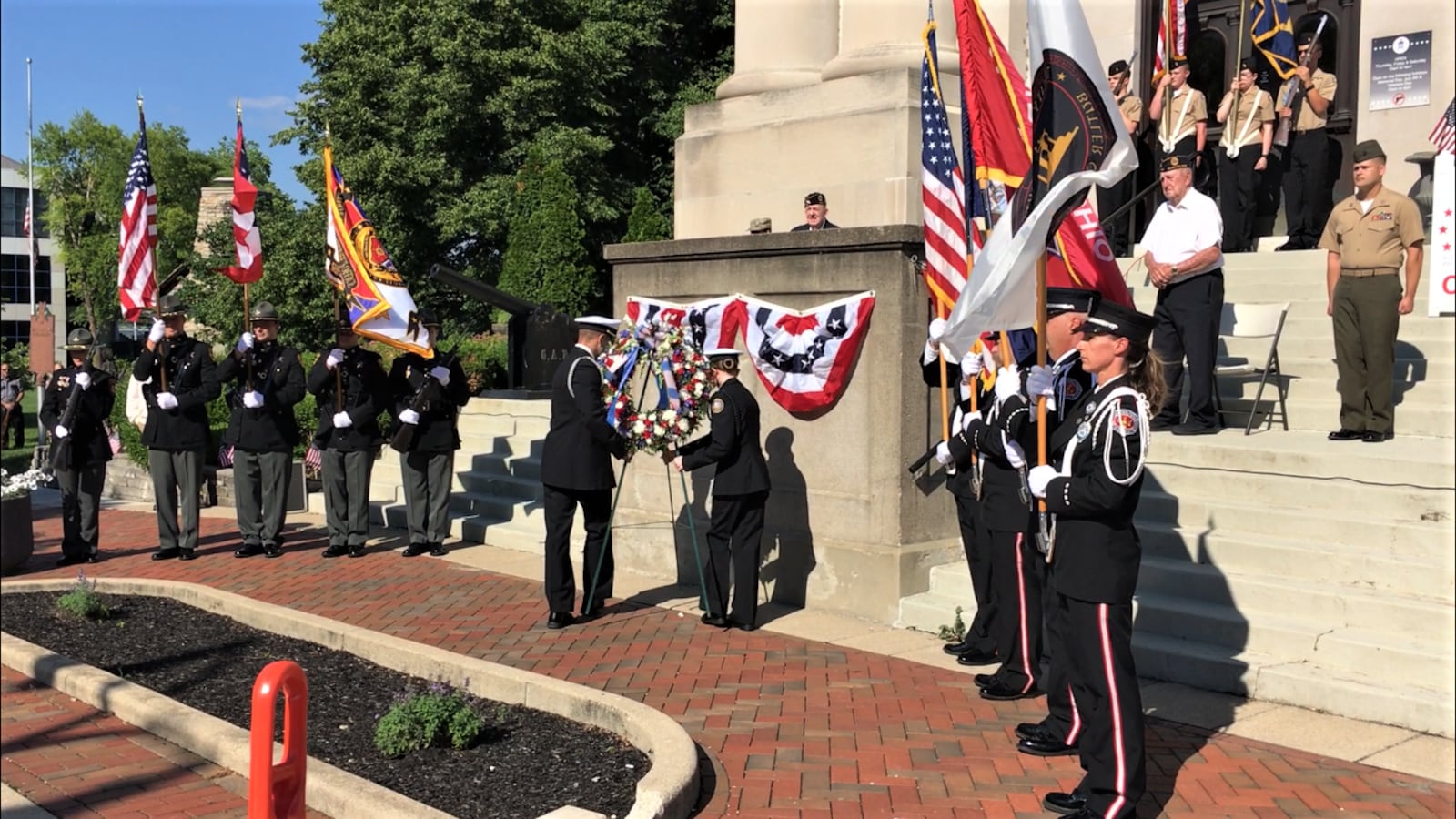 Throughout Butler County on Monday, thousands turned out for Memorial Day parades and events to honor America's fallen military heroes. In Hamilton, military color guards and officials gathered at the downtown Veterans Memorial for the laying of the wreath ceremony. (Photo by Michael D. Clark\Journal-News)