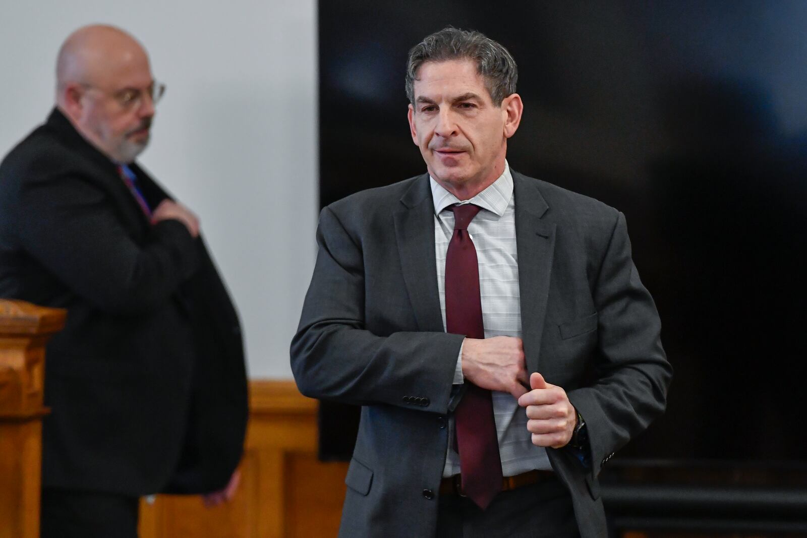 Chautauqua County district attorney Jason Schmidt, right, walks in to Chautauqua County court in Mayville, N.Y., Thursday, Feb. 20, 2025. (AP Photo/Adrian Kraus)