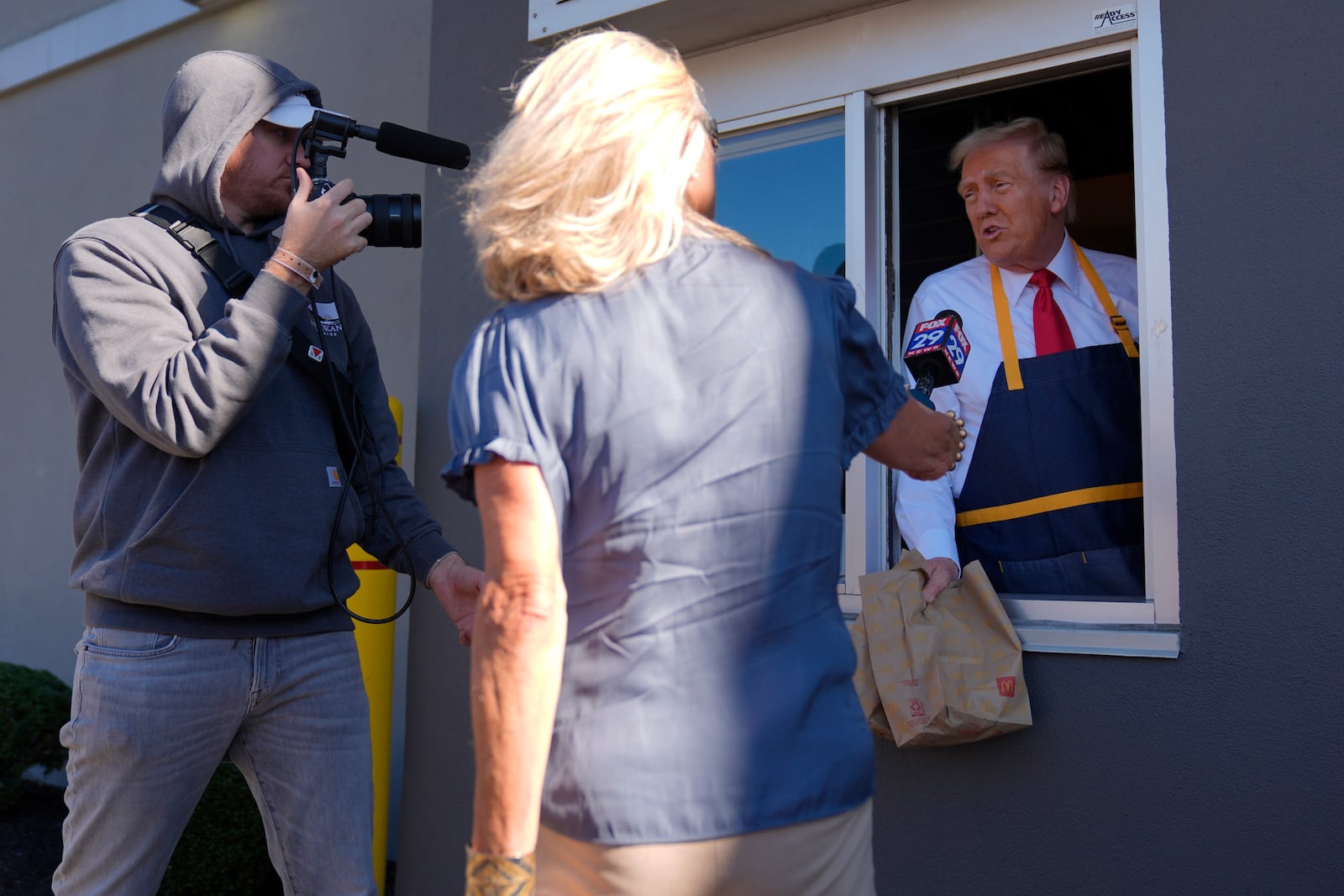 Republican presidential nominee former President Donald Trump speaks during an interview at a drive-thru window during a campaign stop at a McDonald's, Sunday, Oct. 20, 2024, in Feasterville-Trevose, Pa. (AP Photo/Evan Vucci)