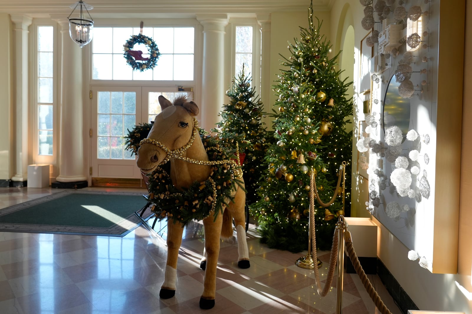 The East Garden Room of the White House in Washington, is decorated for the holidays, Monday, Dec. 2, 2024. (AP Photo/Susan Walsh)