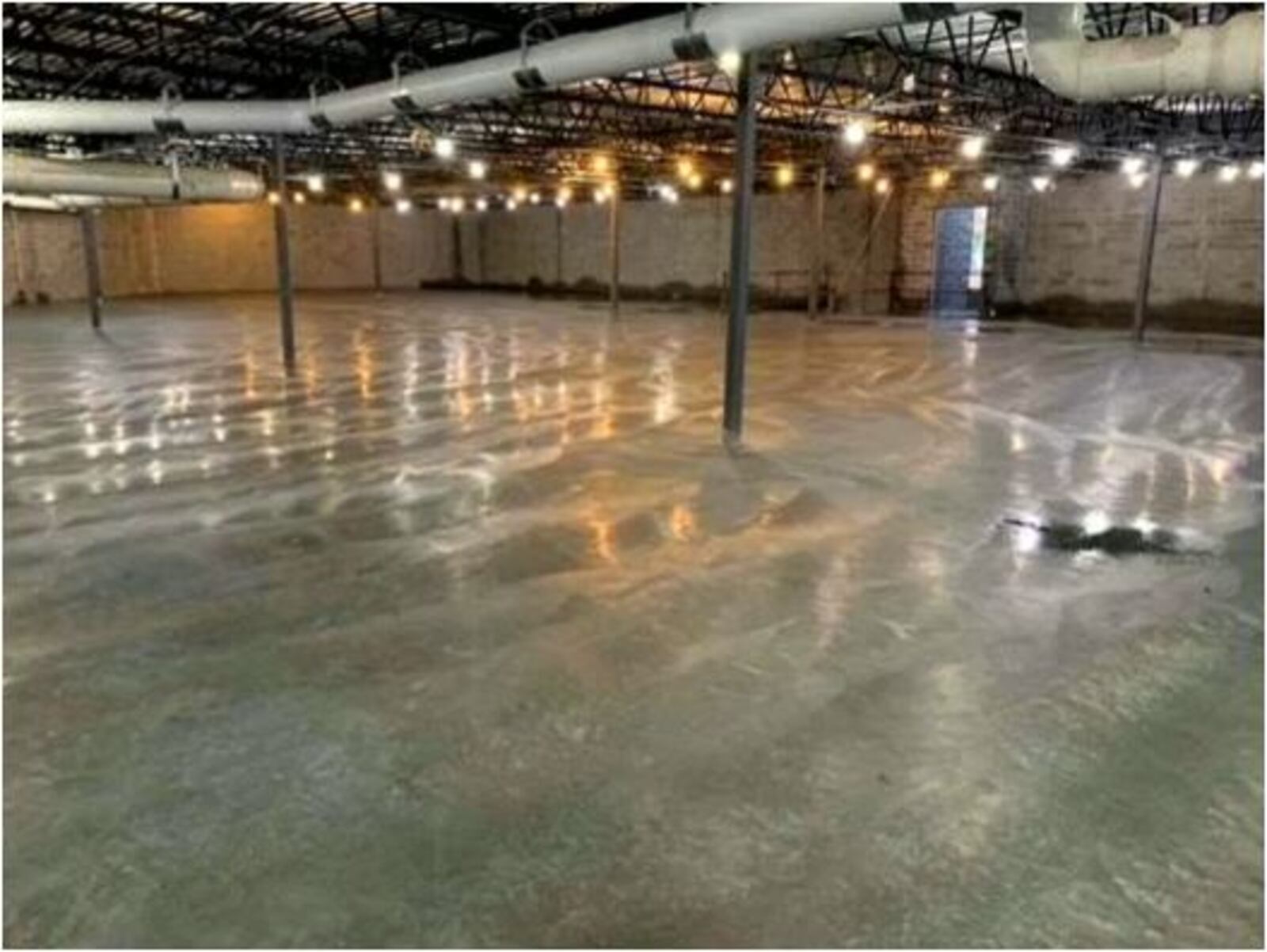 This is a recent photo of the polished concrete in what will be a large room where many simultaneous games of basketball, volleyball and other sports can be played. It also can house large exhibits, such as next summer's Model T exhibit. PROVIDED