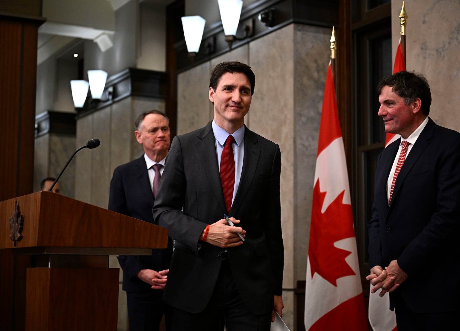 Canadian Prime Minister Justin Trudeau leaves after addressing media members following U.S. President Donald Trump's signing an order to impose stiff tariffs on imports from Mexico, Canada and China, in Ottawa, Canada, Saturday, Feb. 1, 2025. (Justin Tang/The Canadian Press via AP)