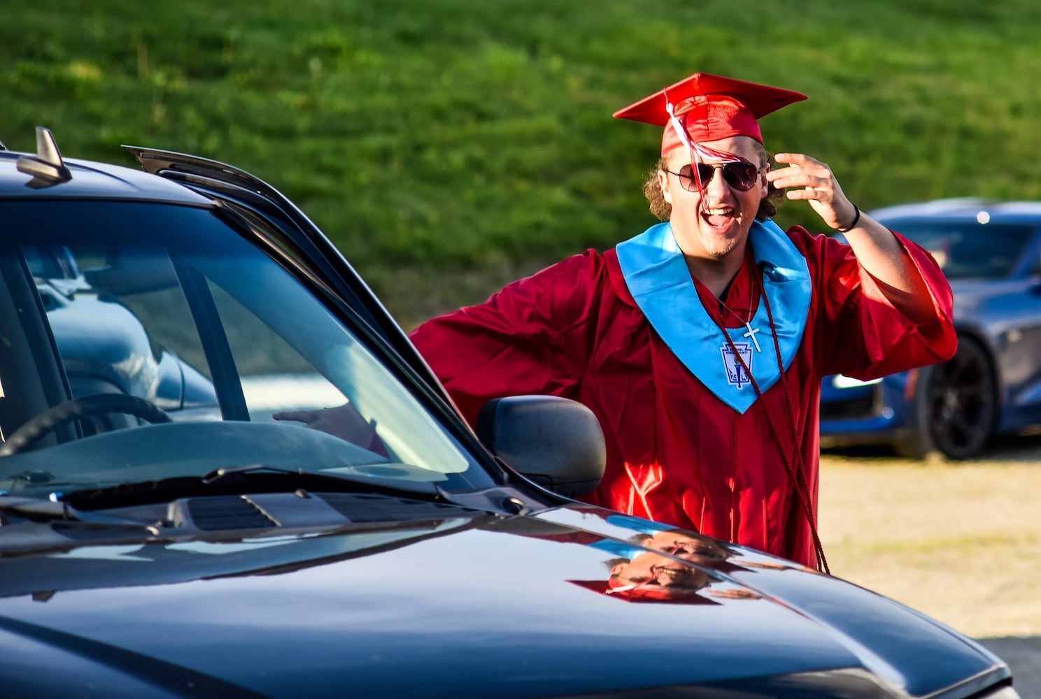 Madison High School drive-thru graduation ceremony at Land of Illusion