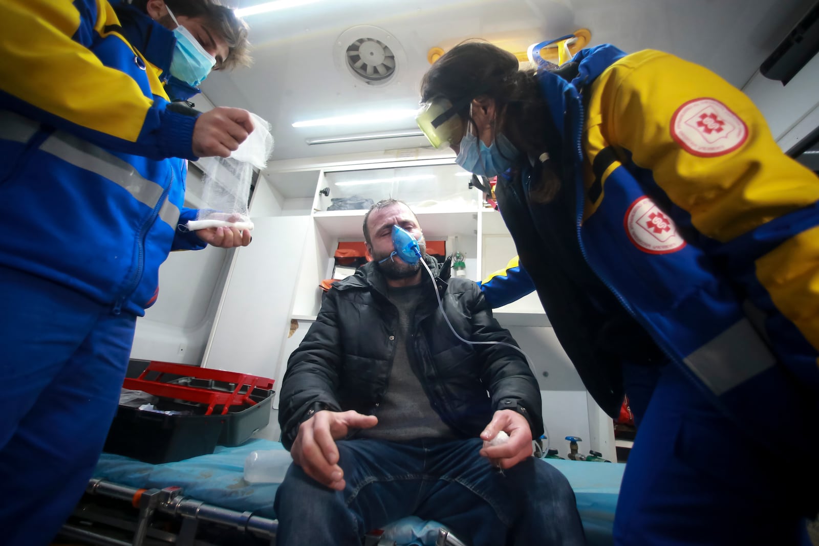 Paramedics treat a protester after clashes with police as demonstrators poured into the streets following Georgian Prime Minister Irakli Kobakhidze's announcement, rallying outside the parliament building in Tbilisi, Georgia Friday, Nov. 29, 2024. (AP Photo/Zurab Tsertsvadze)