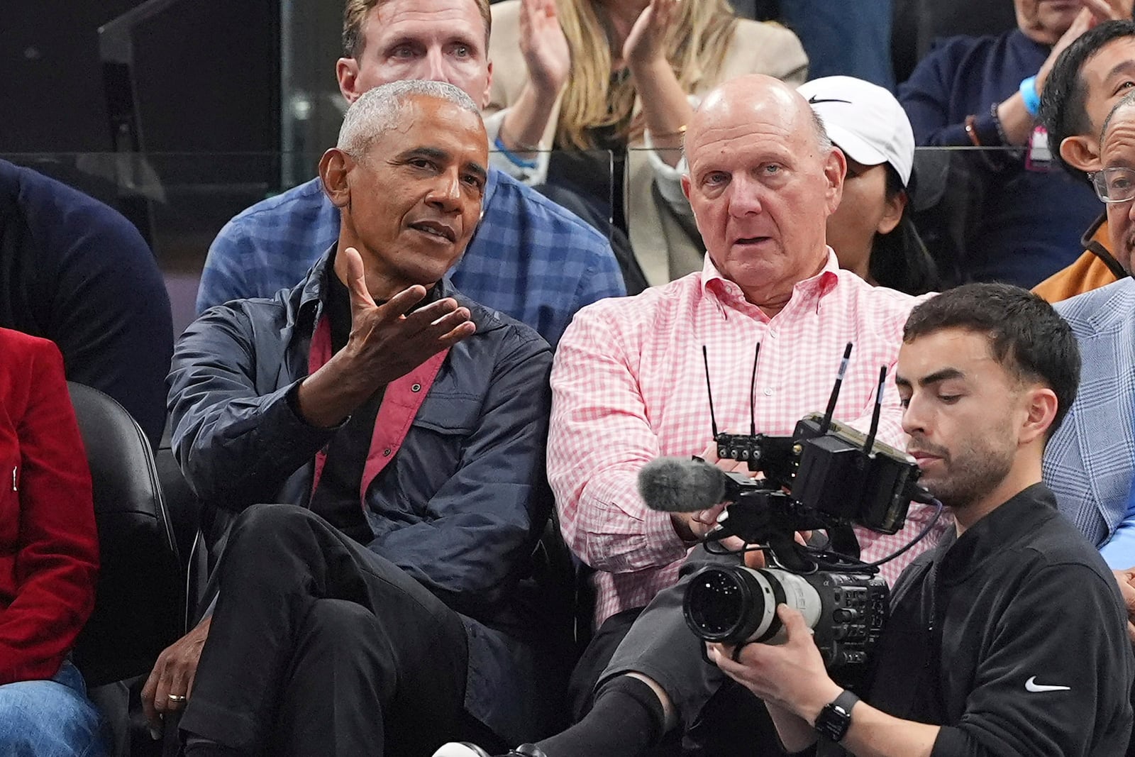 Former President Barack Obama, left, sits with Los Angeles Clippers owner Steve Ballmer during the first half of an NBA basketball game between the Clippers and the Detroit Pistons, Wednesday, March 5, 2025, in Inglewood, Calif. (AP Photo/Mark J. Terrill)