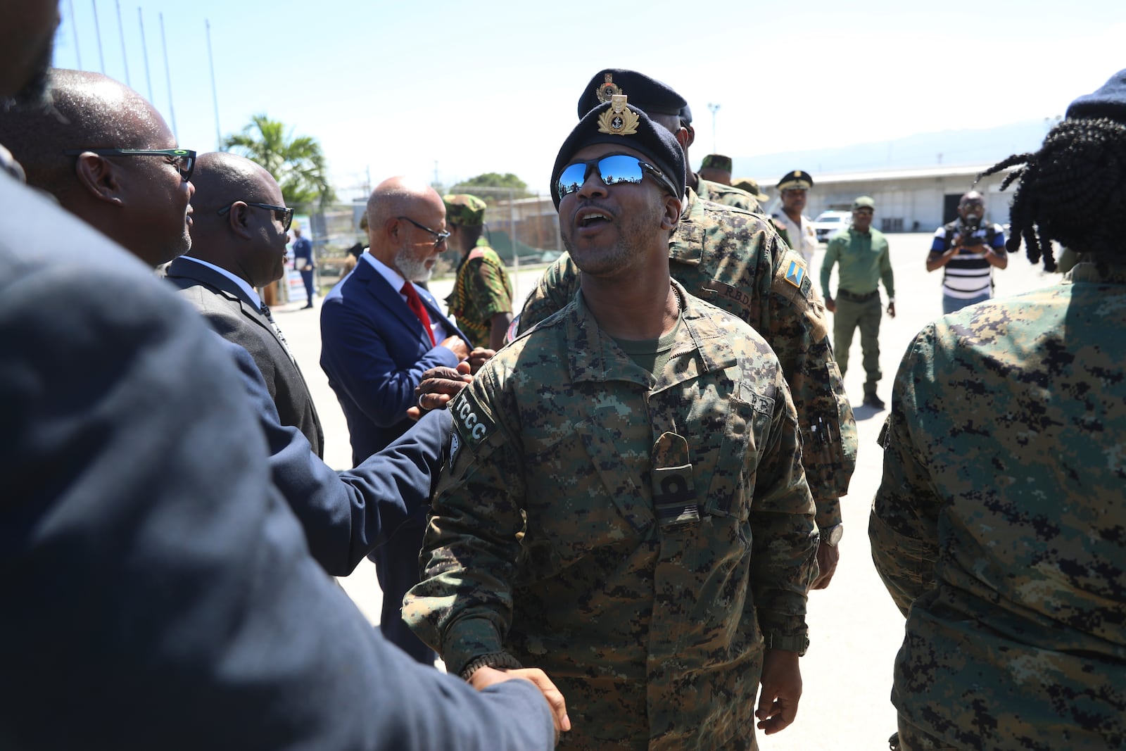 Police from Bahamas are welcomed by Haitian and Kenyan police, part of a UN-backed multinational force, at the Toussaint Louverture International Airport in Port-au-Prince, Haiti, Friday, Oct. 18, 2024. (AP Photo/Odelyn Joseph)