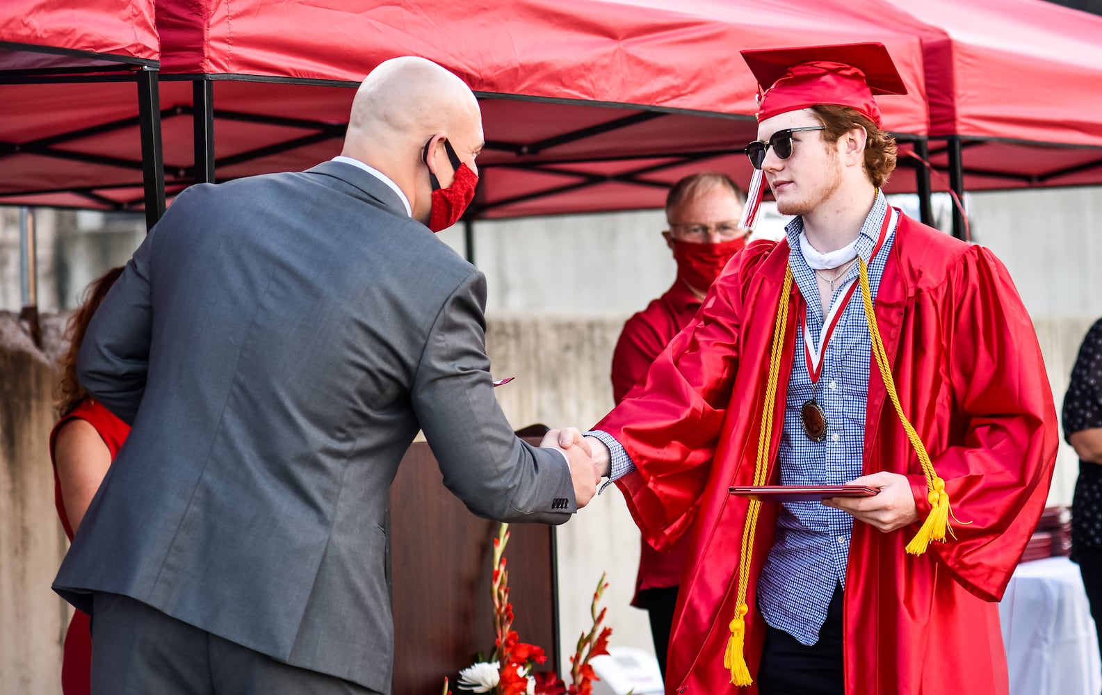 Madison High School drive-thru graduation ceremony at Land of Illusion