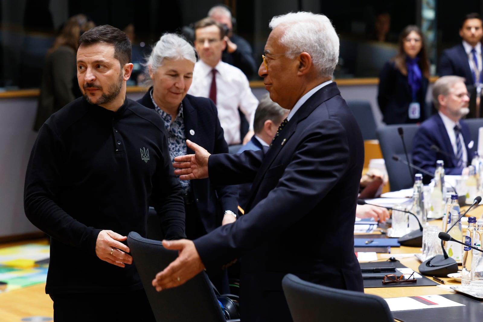 Ukraine's President Volodymyr Zelenskyy, left, and European Council President Antonio Costa, right, during a round table meeting at an EU Summit in Brussels, Thursday, March 6, 2025. (AP Photo/Geert Vanden Wijngaert)