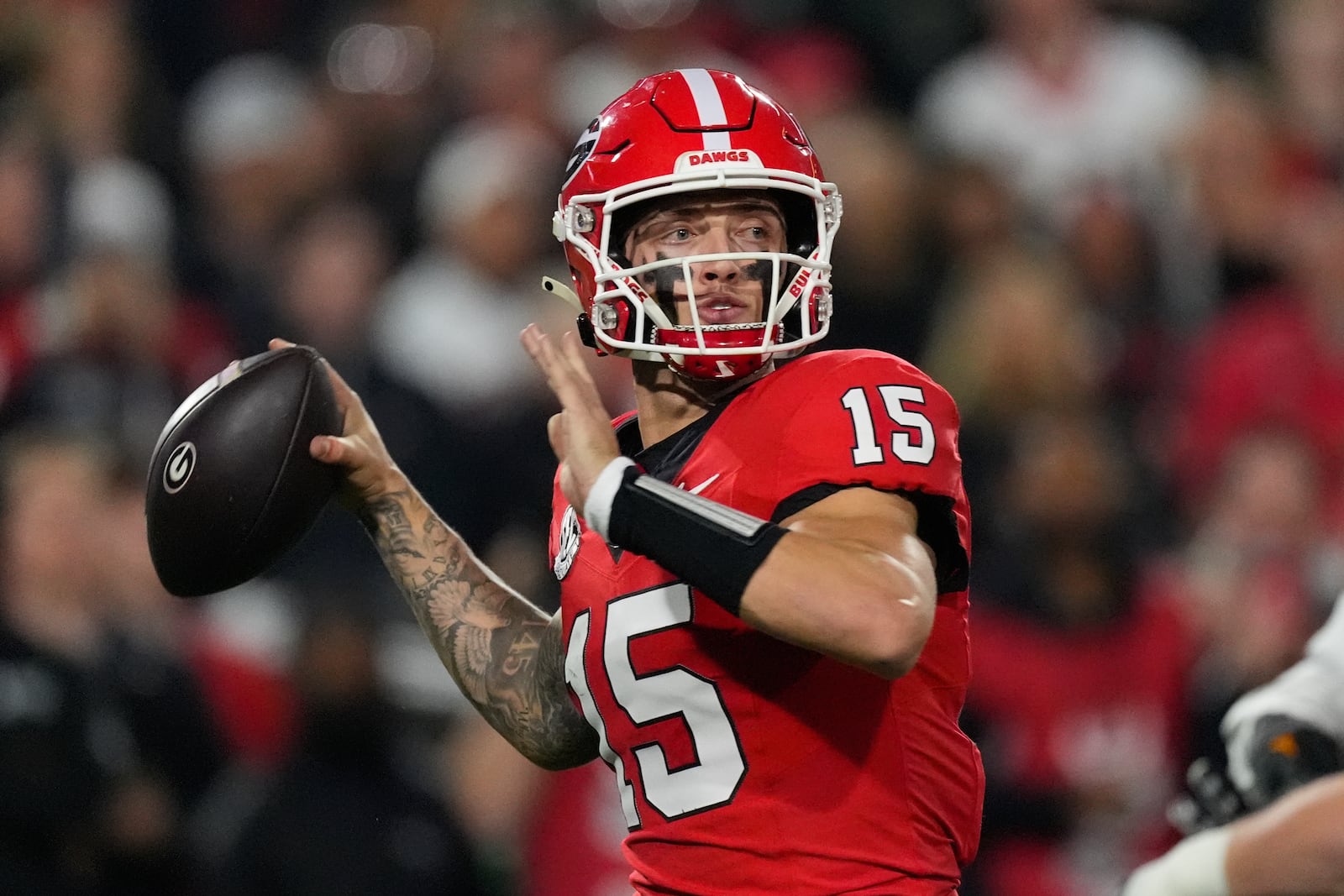 Georgia quarterback Carson Beck (15) looks for an open receiver during the first half of an NCAA college football game against Tennessee, Saturday, Nov. 16, 2024, in Athens, Ga. (AP Photo/John Bazemore)