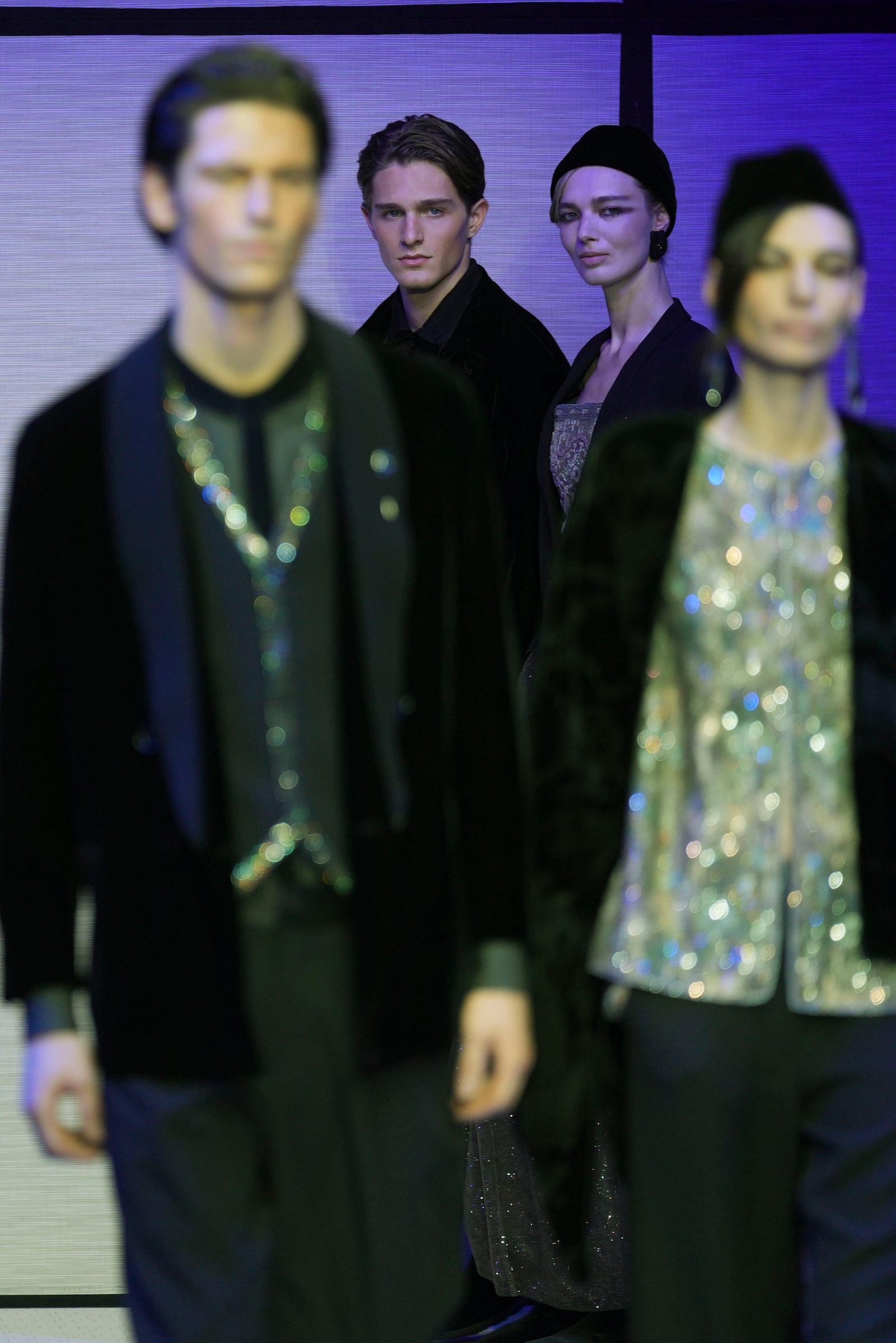 Models wear creations part of the men's Giorgio Armani Fall-Winter 2025-2026 collection, that was presented in Milan, Italy, Monday, Jan. 20, 2025. (AP Photo/Antonio Calanni)