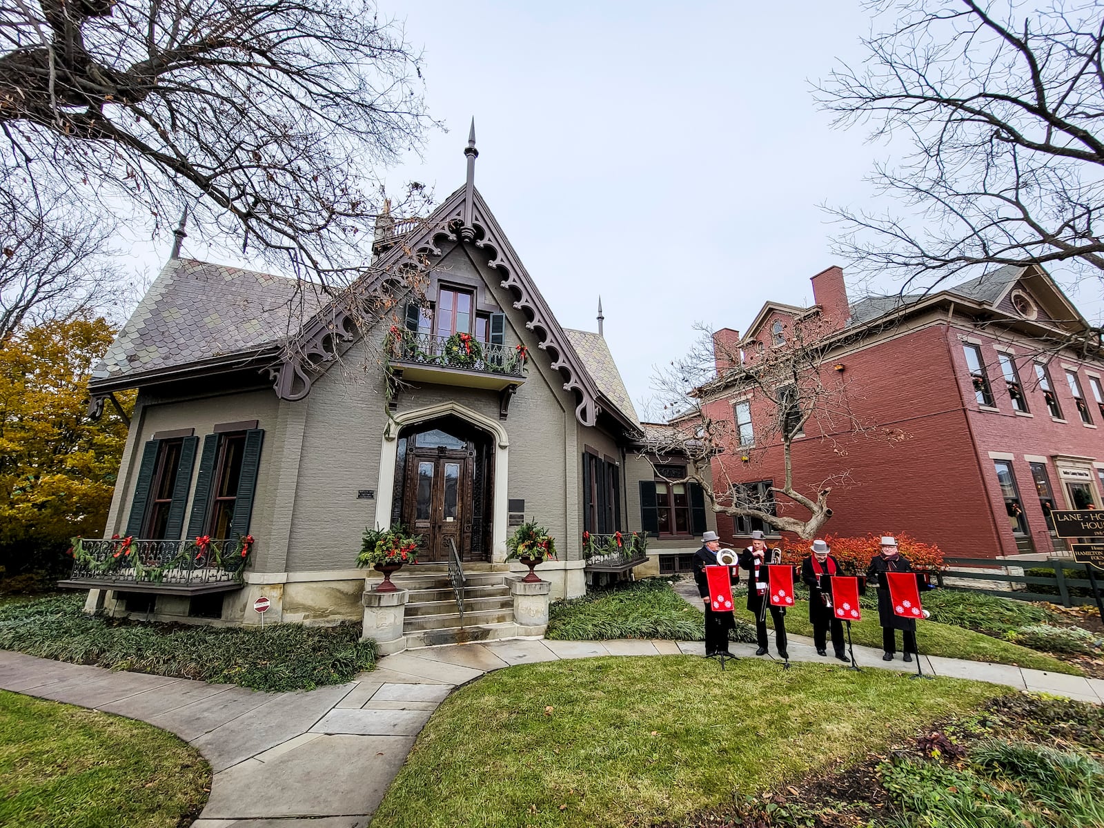 The German Village Christmas Walk was held Sunday, Dec. 5, 2021 in Hamilton. Businesses and homes were decorated for the holidays and musicians performed to offer a glimpse of German Village Christmas nostalgia. Yuletide Brass quartet performs in front of the Lane-Hooven House during the event. NICK GRAHAM / STAFF