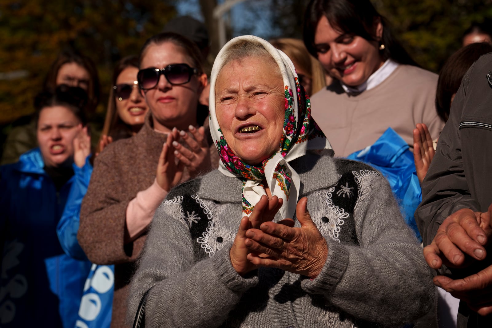 Supporters of Renato Usatii, leader of the Our Party and presidential candidate, applaud him during a rally on the final day of electoral campaign in Chisinau, Moldova, Friday, Oct. 18, 2024, ahead of a presidential election and a referendum on whether to enshrine in Moldova's Constitution its path to European Union membership that will take place on Oct. 20. (AP Photo/Vadim Ghirda)