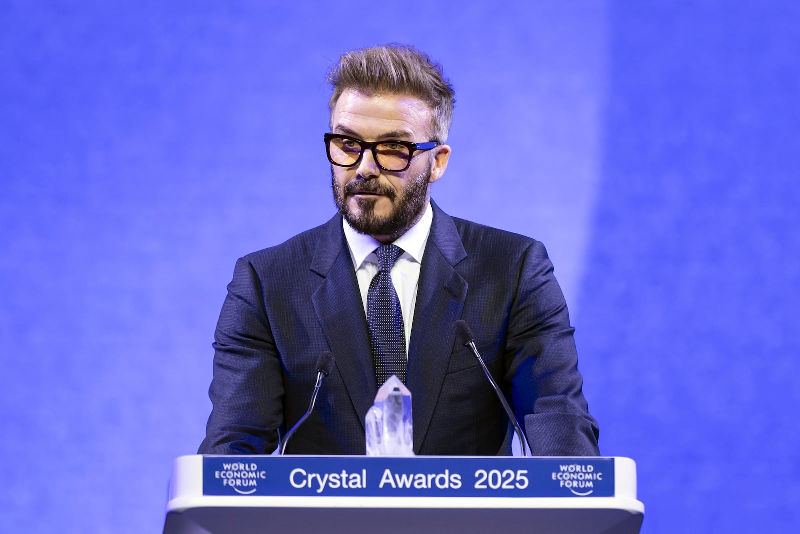 David Beckham speaks as he receives a Crystal Award, at the 55th annual meeting of the World Economic Forum, WEF, in Davos, Switzerland, Monday, Jan. 20, 2025. (Michael Buholzer/Keystone via AP)