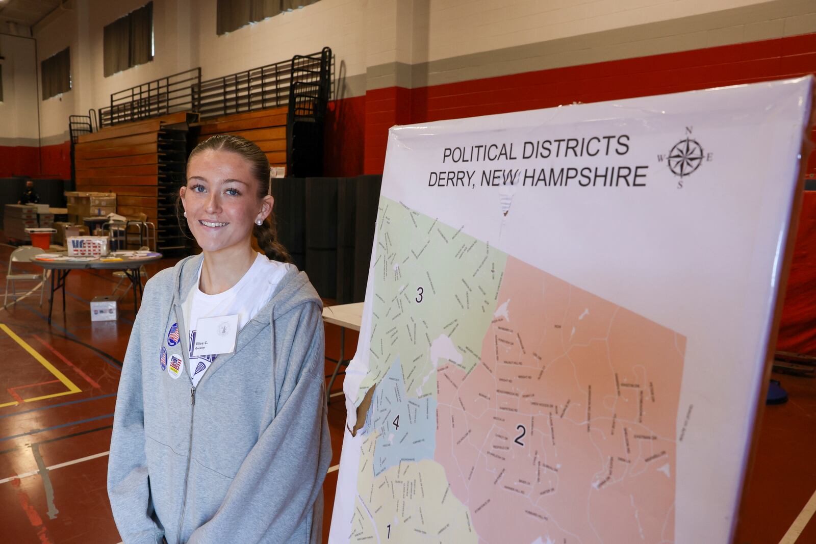 Election volunteer and first-time voter Elise Collins poses for a photo in Derry, N.H., Tuesday, March 11, 2025. (AP Photo/Reba Saldanha)