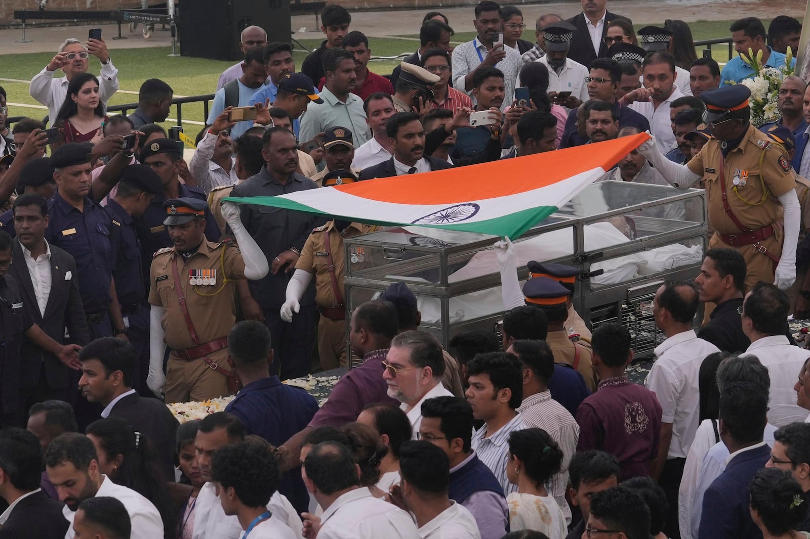 Body of Indian business leader Ratan Tata who died on Wednesday night is taken for cremation with full state honors, in Mumbai, India, Thursday, Oct. 10, 2024. (AP Photo /Rafiq Maqbool)