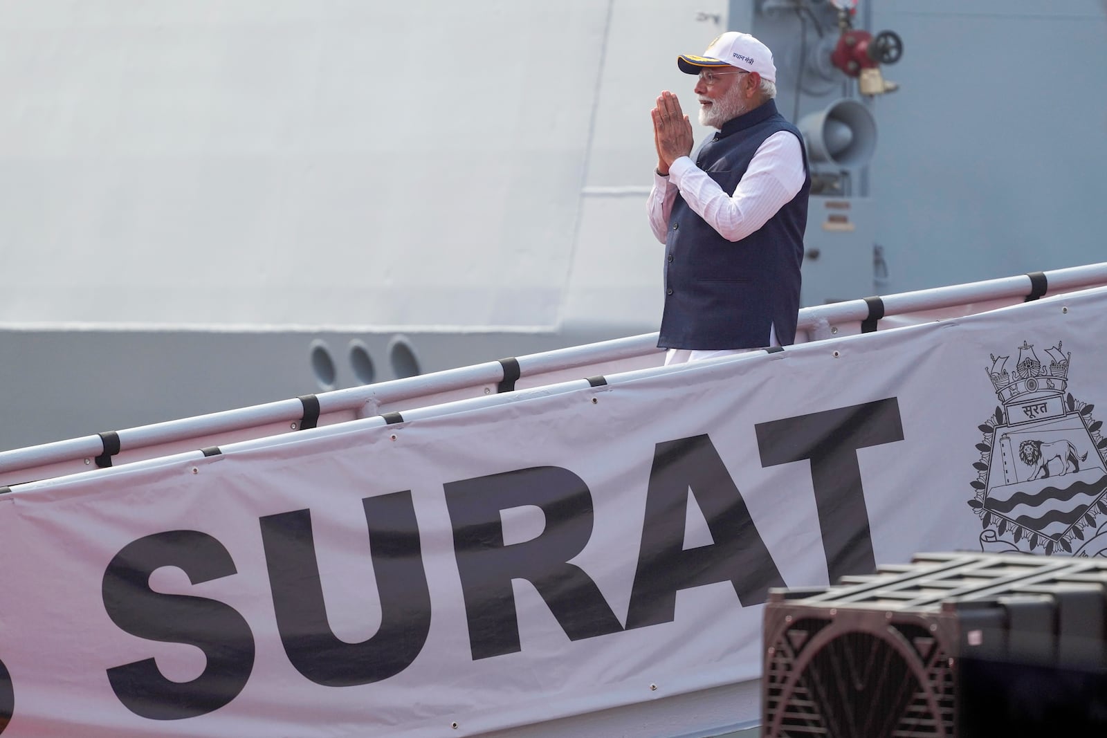 Indian Prime Minister Narendra Modi greets after the commissioning of INS Surat at a naval dockyard in Mumbai, India, Wednesday, Jan. 15, 2025. (AP Photo/Rafiq Maqbool)