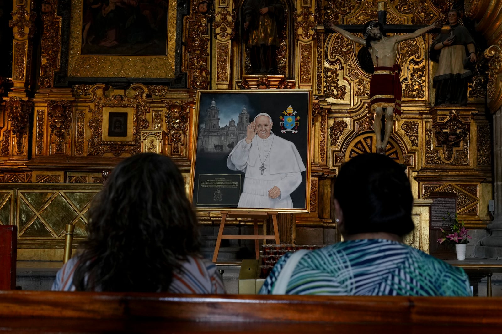 Parishioners pray for the health of Pope Francis at the Metropolitan Cathedral in Mexico City, Thursday, Feb. 27, 2025. (AP Photo/Marco Ugarte)