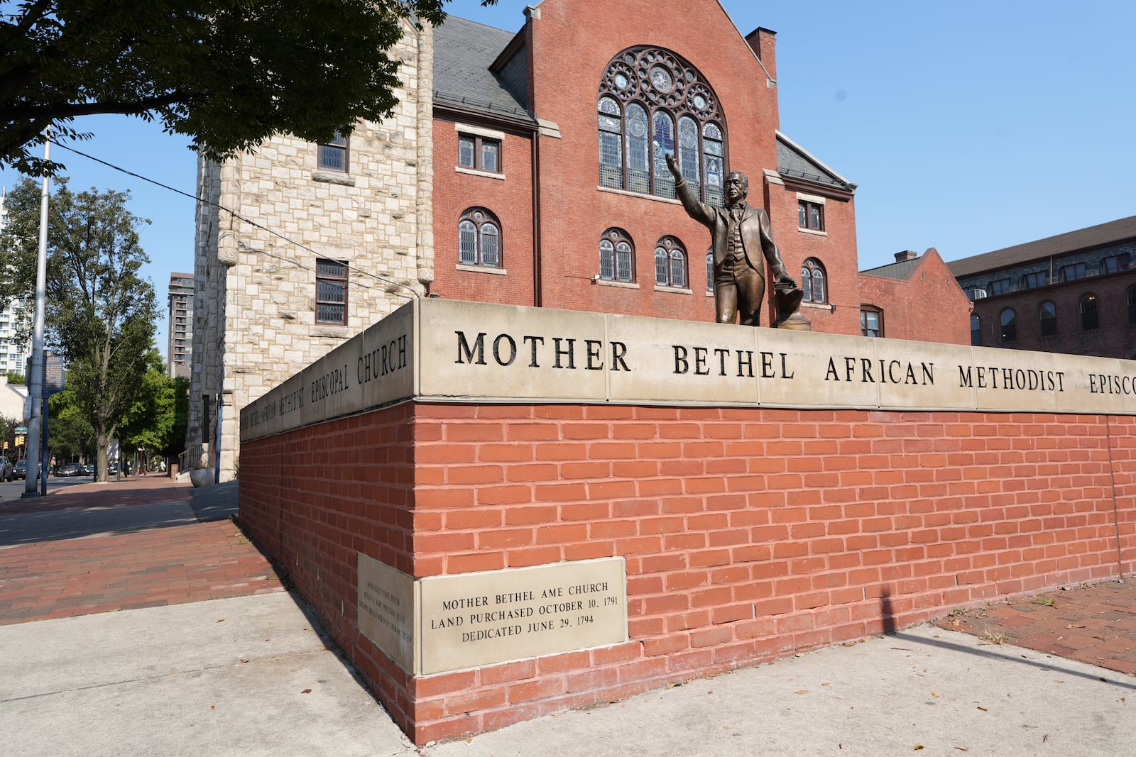 A statue of Mother Bethel AME Church founder stands on the oldest parcel of land continuously owned by Black Americans in Philadelphia on Oct 13, 2024. (AP Photo/Luis Andres Henao)