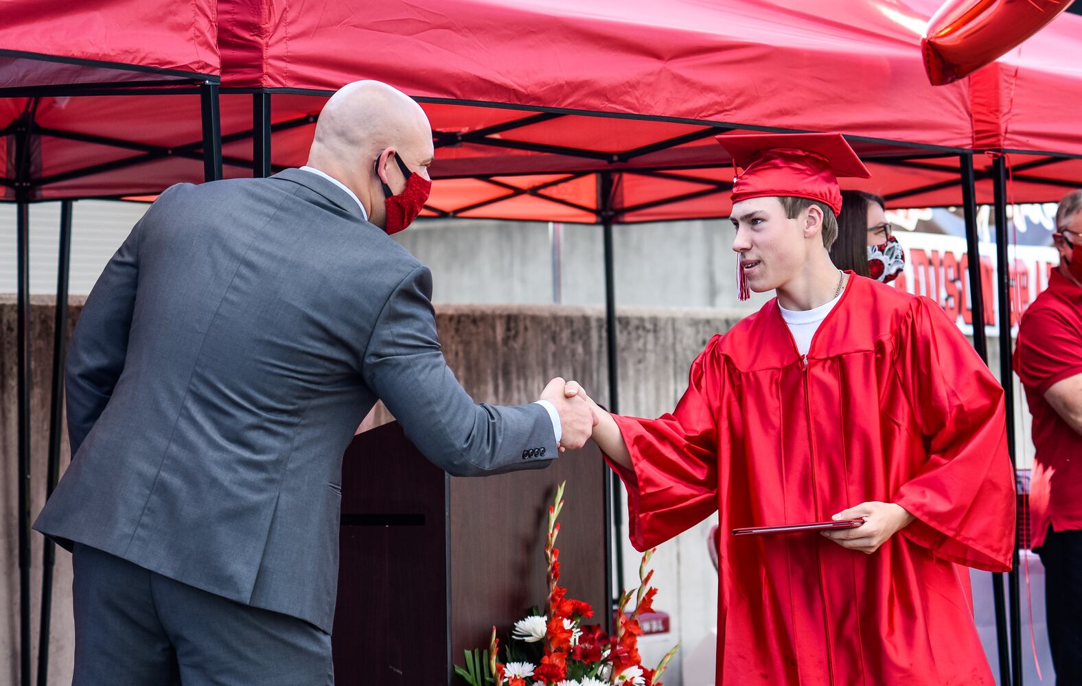 Madison High School drive-thru graduation ceremony at Land of Illusion