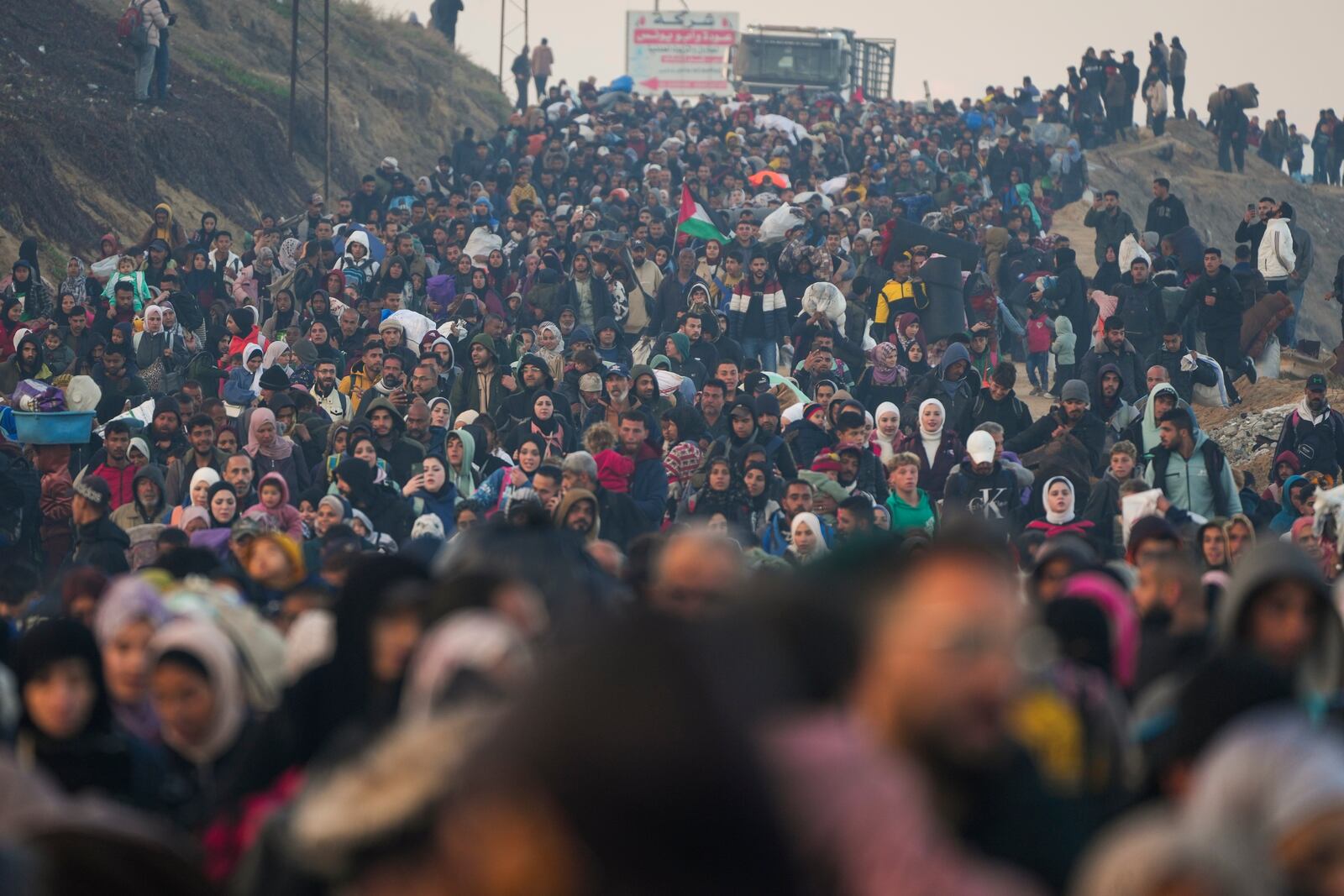 Displaced Palestinians return to their homes in the northern Gaza Strip, following Israel's decision to allow thousands of them to go back for the first time since the early weeks of the 15-month war with Hamas, Monday, Jan. 27, 2025. (AP Photo/Abdel Kareem Hana)