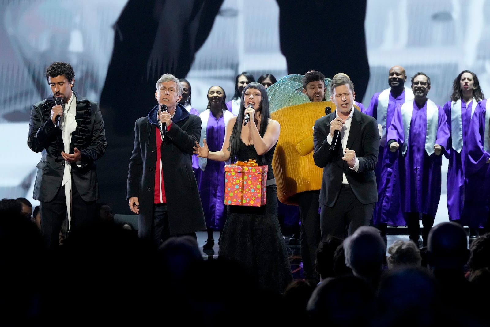 This image released by Peacock shows Bad Bunny, from left, Chris Parnell, Lady Gaga, and Andy Samberg performing during "SNL50: The Homecoming Concert" on Friday, Feb. 14, 2025, in New York. (Virginia Sherwood/Peacock via AP)