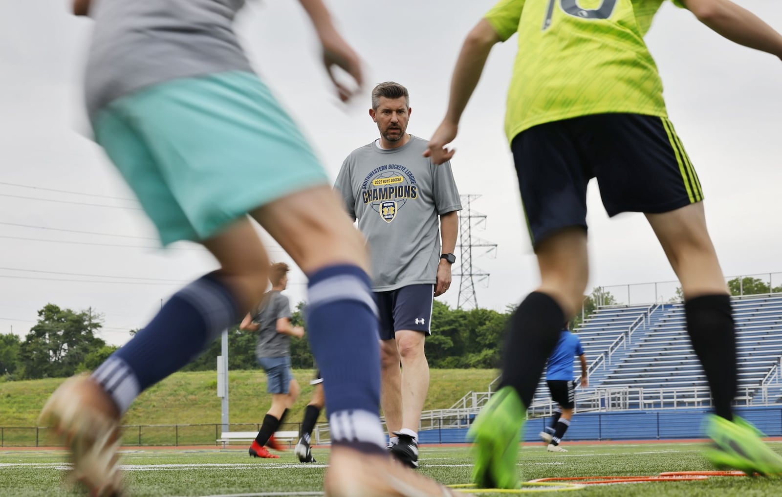 Butler County Common Pleas Court Judge Michael Oster Jr. spends a good amount of his time away from court on the soccer field coaching Monroe High School boys varsity soccer team. NICK GRAHAM/STAFF