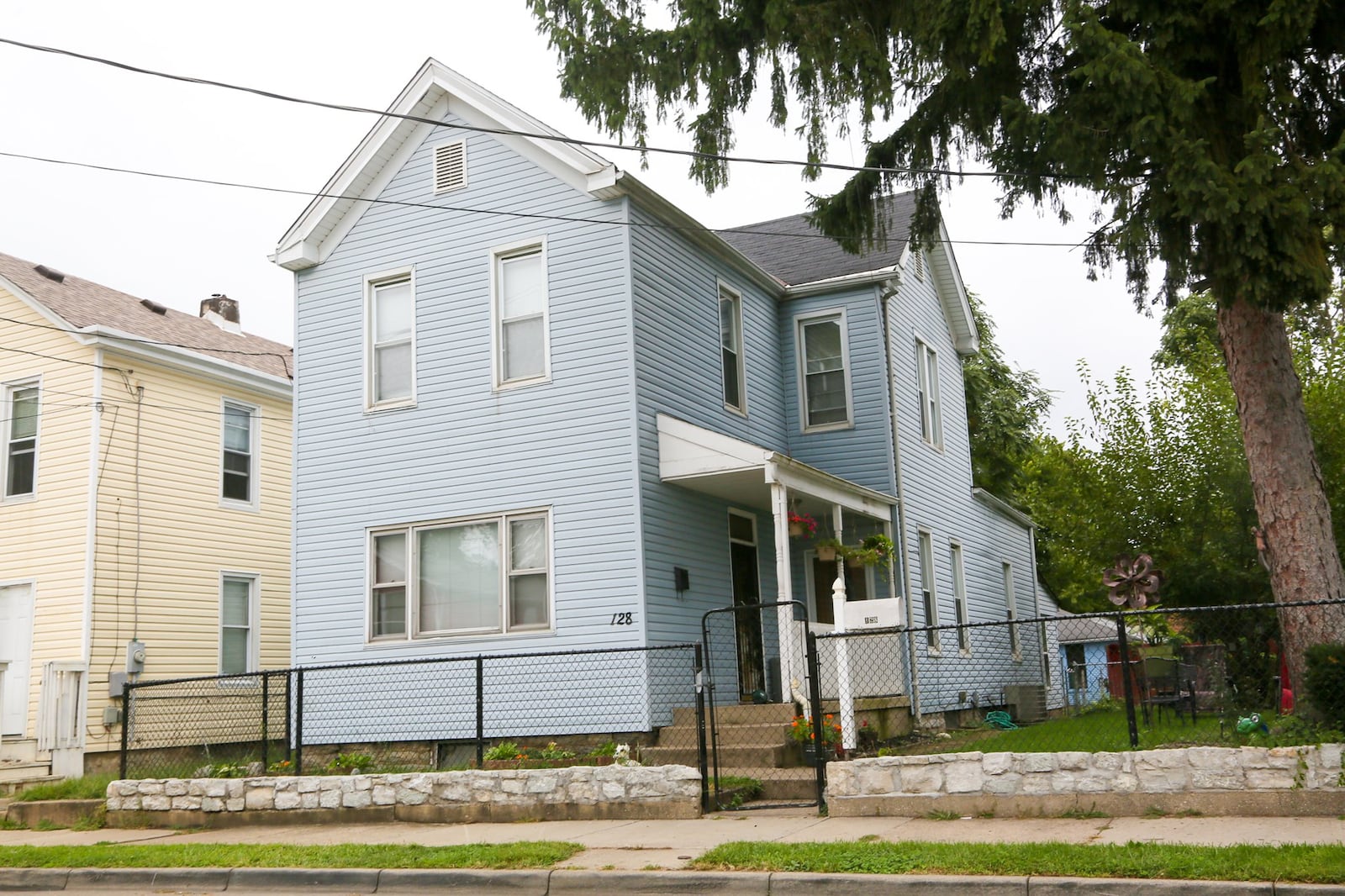 A house at 128 Beckett St. was raided along with two other locations as part of a drug bust by the Hamilton Police Department at the conclusion of a four month investigation. GREG LYNCH / STAFF