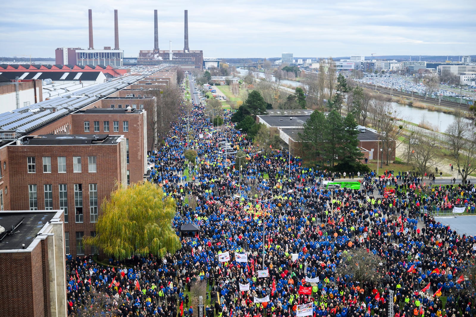 Volkswagen workers attend a rally during at nationwide warning Volkswagen workers' strike, on the grounds of the main Volkswagen plant in Wolfsburg, Germany, Monday, Dec. 2, 2024. (Julian Stratenschulte/dpa via AP)