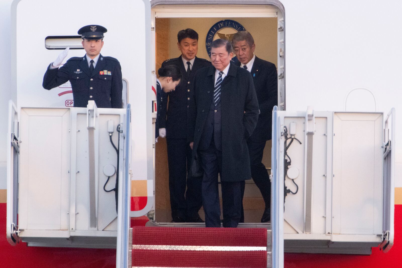 Japan's Prime Minister Shigeru Ishiba arrives at Joint Base Andrews, Md., Thursday, Feb. 6, 2025. (AP Photo/Kevin Wolf)