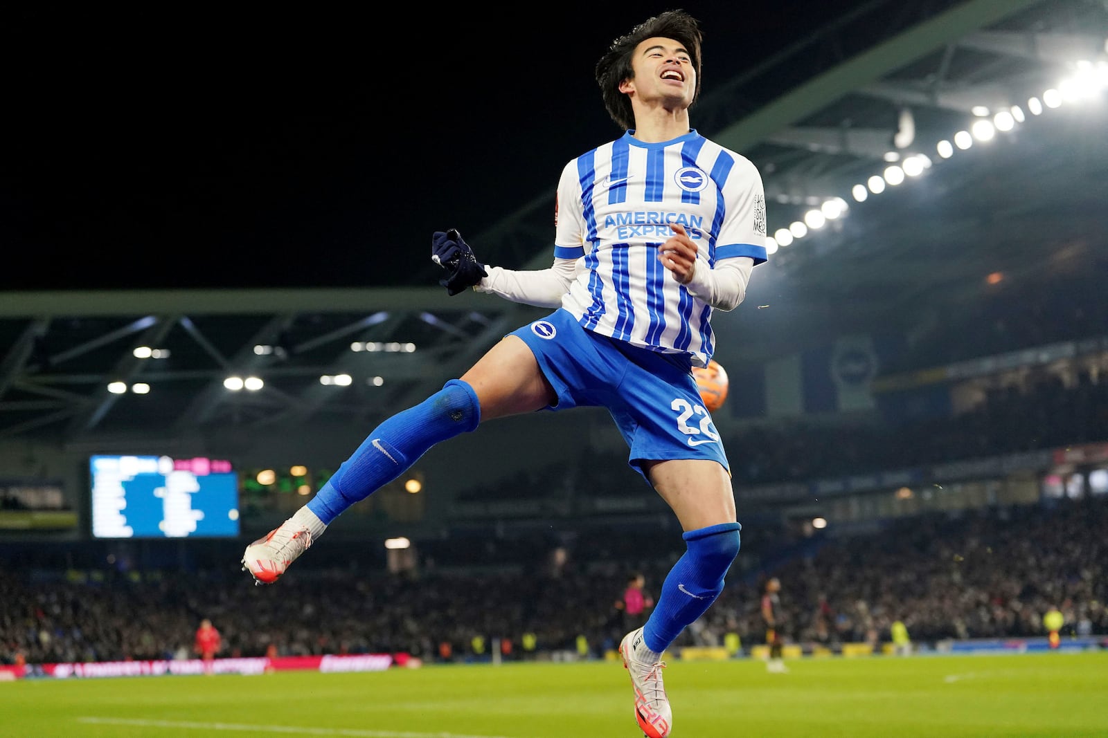 Brighton and Hove Albion's Kaoru Mitoma celebrates scoring their side's second goal of the gamel during the English FA Cup fourth round soccer match between Brighton & Hove Albion and Chelsea at American Express Stadium, Brighton, England, Saturday Feb. 8, 2025. (Gareth Fuller/PA via AP)