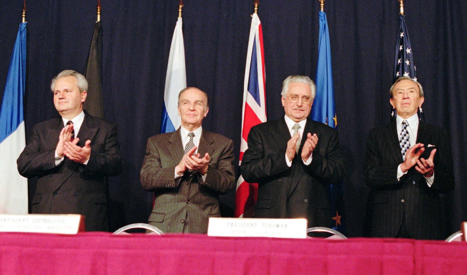 Serbian President Slobodan Milosevic, left, Bosnian President Alija Izetbegovic, Croatian President Franjo Tudjman and U.S. Secretary of State Warren Christopher applaud after initialing a pact after an agreement was reached, Nov. 21, 1995, at Wright-Patterson Air Force Base after 21 days at the Proximity Peace Talks in Dayton, Ohio.The U.S.-brokered accord, reached in Dayton, ended Bosnia's 1992-95 war between rival Muslim Bosniaks, Orthodox Serbs and Roman Catholic Croats, who clashed on the republic's future after the former Yugoslav federation fell apart. Milosevic is now on trial for war crimes in The Hague. Izetbegovic died of heart failure on Oct. 19, 2003, at the age of 78, and  Tudjman died in 1999.(AP Photo/Michael Heinz)