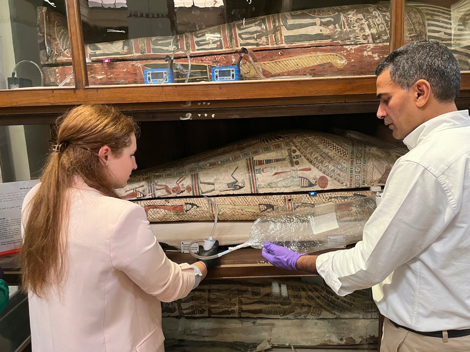 In this undated photo provided by Abdelrazek Elnaggar, Emma Paolin, PhD student at University of Ljubljana, sets up active air sampling with sorbent tubes and pumps. (Abdelrazek Elnaggar via AP)