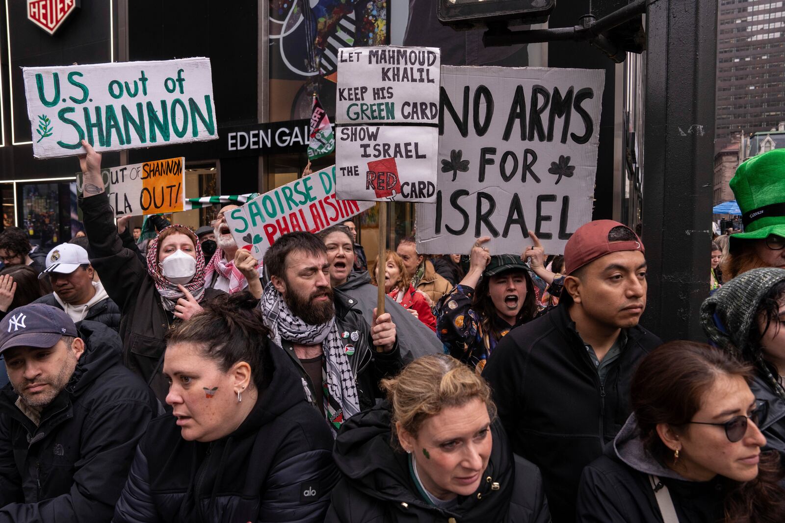 Protestors shout during the 264th New York City Saint Patrick's Day Parade, Monday, March 17, 2025 in New York. (AP Photo/Adam Gray)