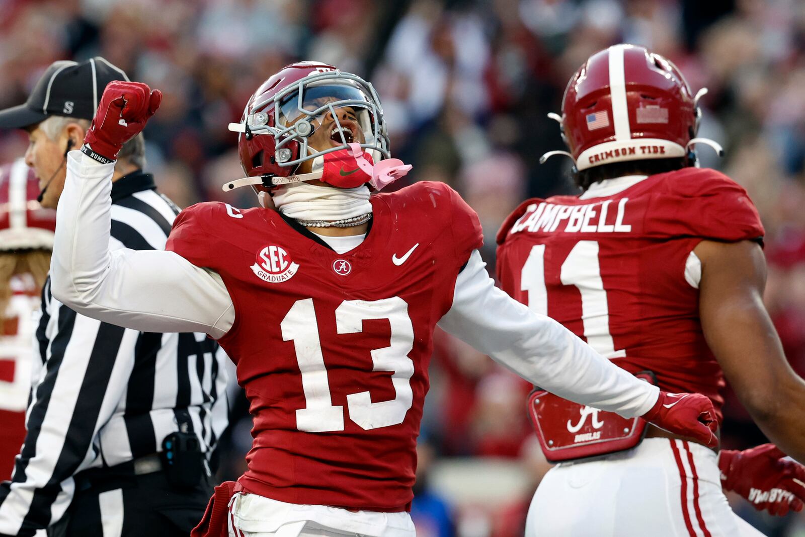 Alabama defensive back Malachi Moore (13) reacts after a defensive play against Auburn during the first half of an NCAA college football game, Saturday, Nov. 30, 2024, in Tuscaloosa, Ala. (AP Photo/Butch Dill)