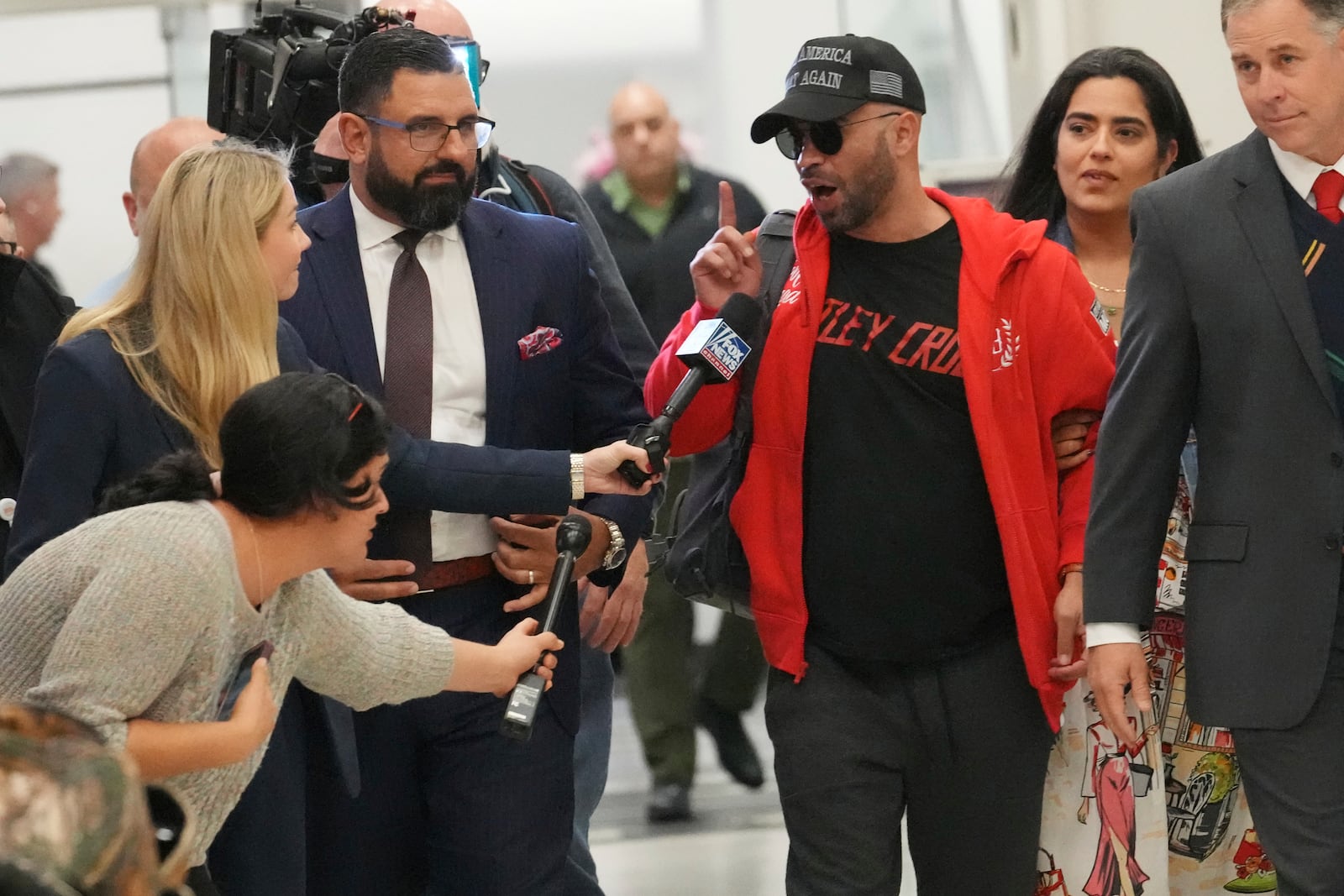 Recently pardoned by President Donald Trump after he was convicted of seditious conspiracy for his role in the January 6 attack on the U.S. Capitol, Enrique Tarrio answers questions after he arrived at Miami International Airport, Wednesday, Jan. 22, 2025, in Miami. (AP Photo/Marta Lavandier)