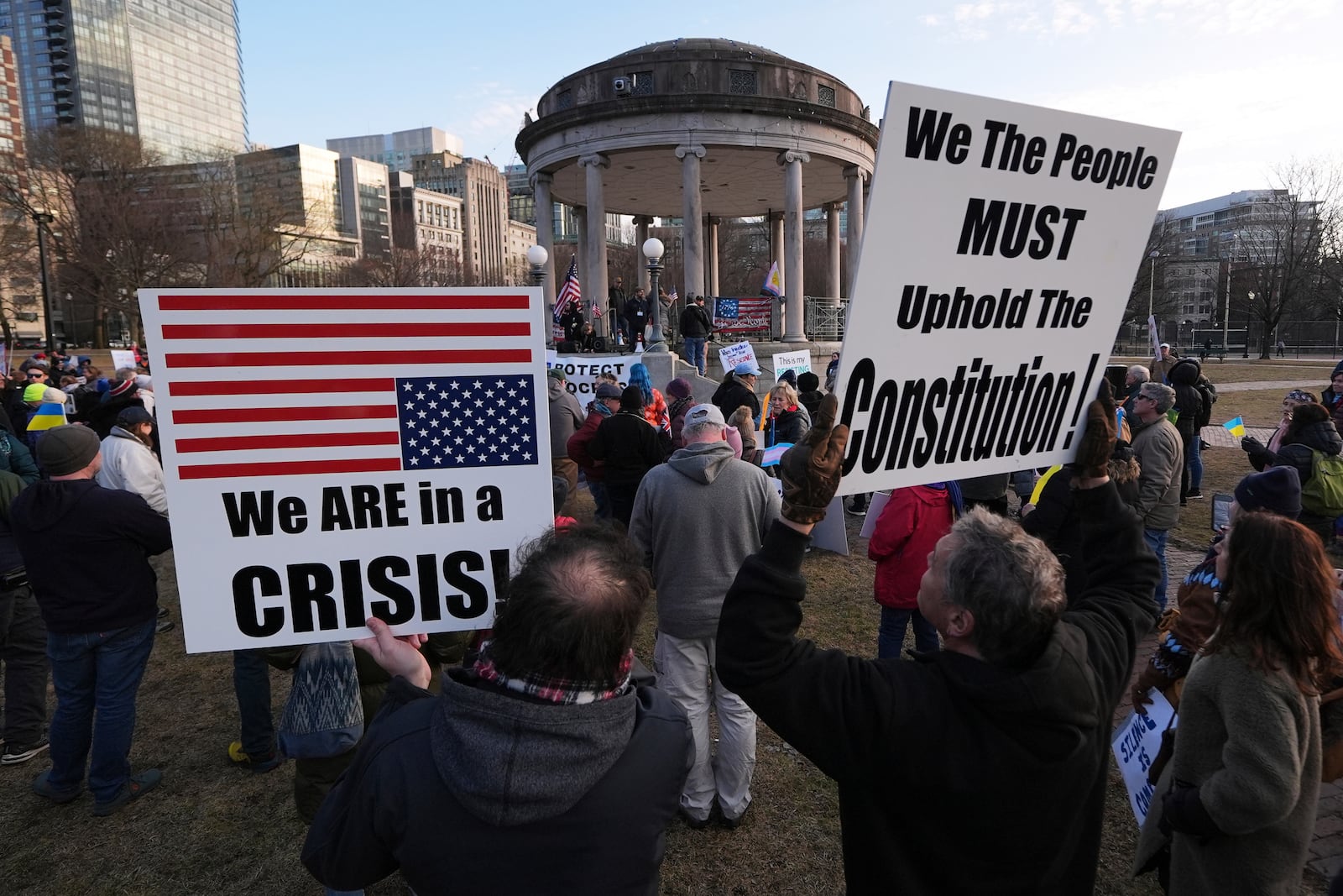 People protest on Boston Common, Tuesday, March 4, 2025, in Boston. (AP Photo/Charles Krupa)