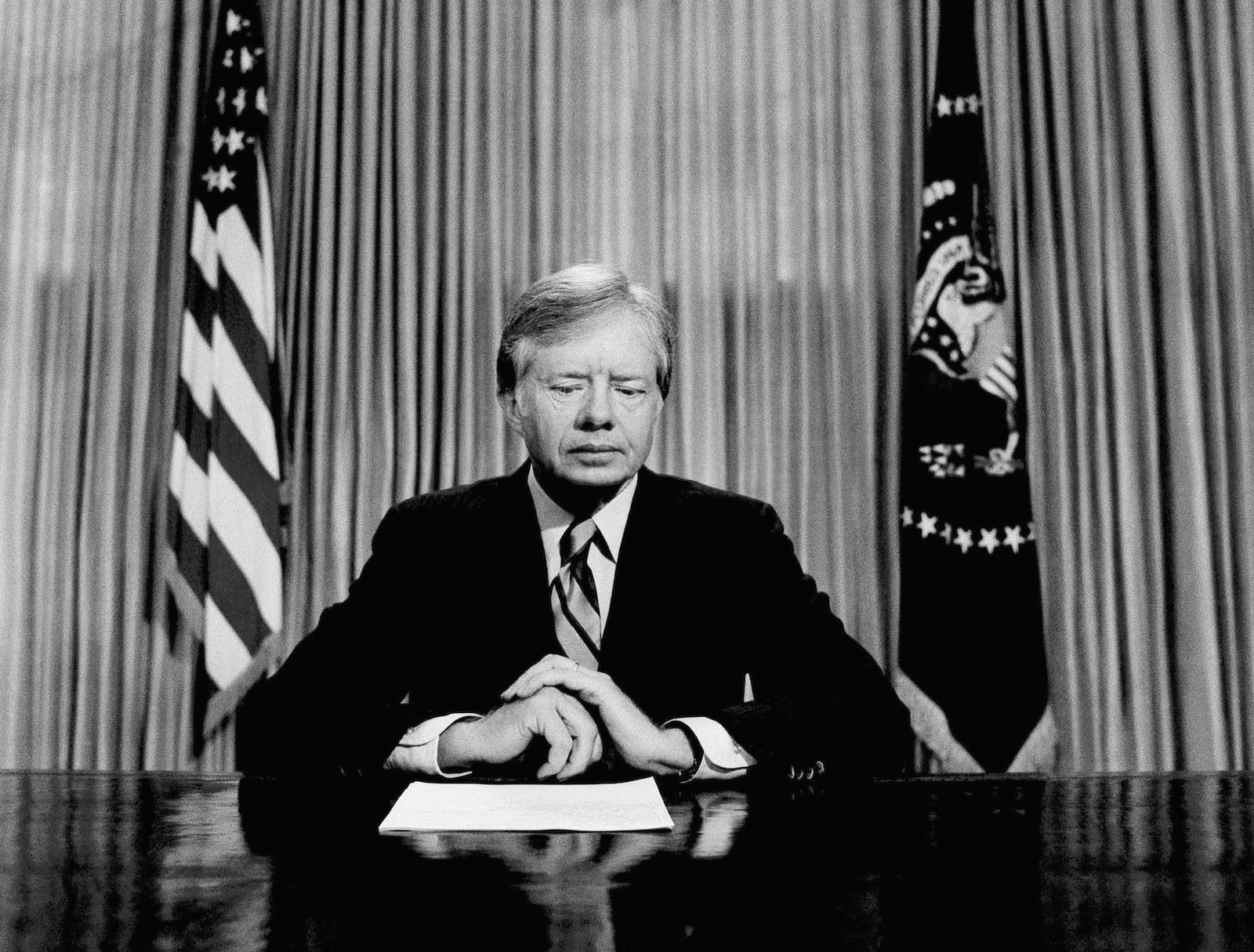 FILE - President Jimmy Carter prepares to make a national television address from the Oval Office at the White House, April 25, 1980, in Washington, on the failed mission to rescue the Iran hostages. (AP Photo, File)