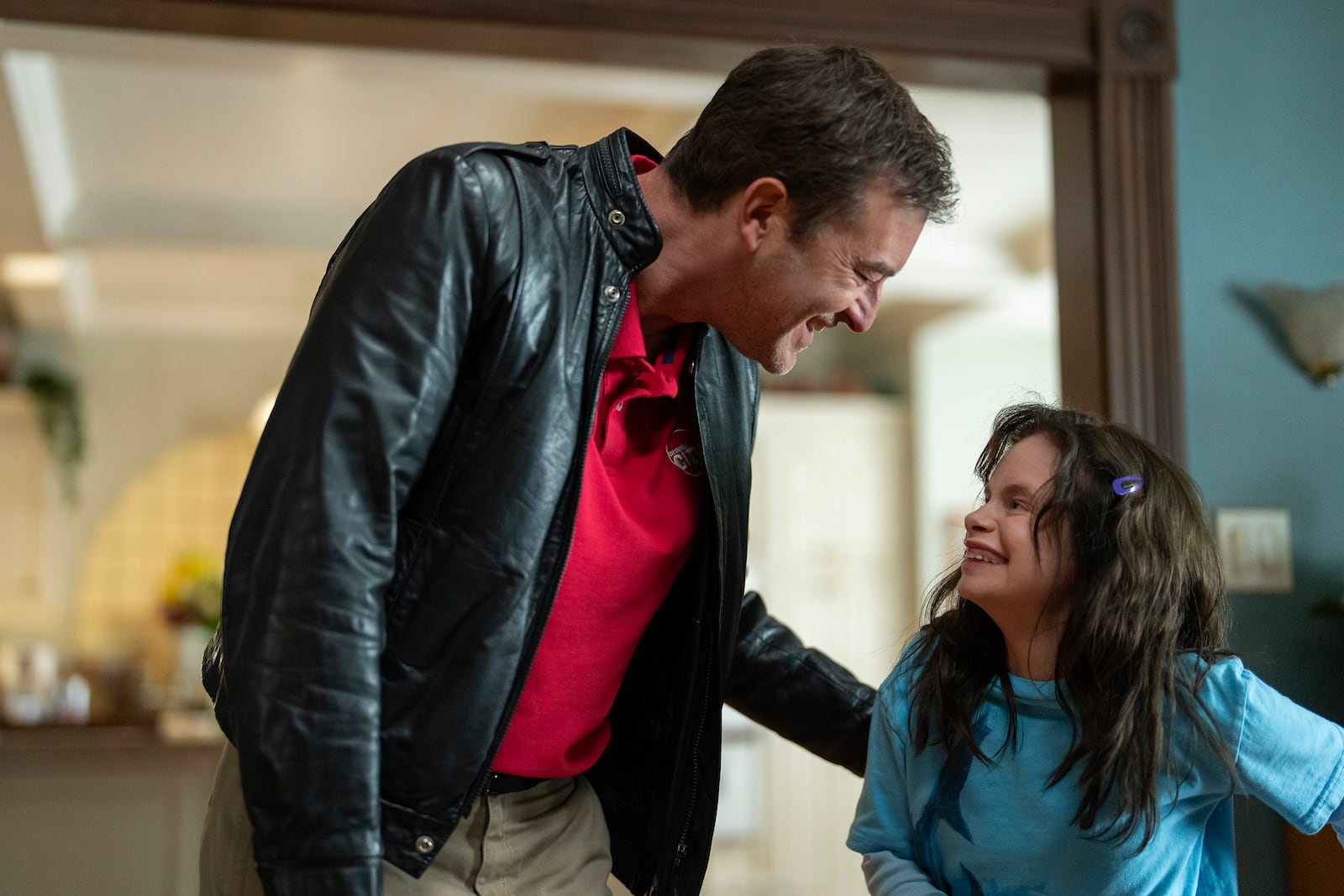 This image released by Disney shows Mark Duplass, left, and Imogen Faith Reid in a scene from "Good American Family." (Ser Baffo/Disney via AP)