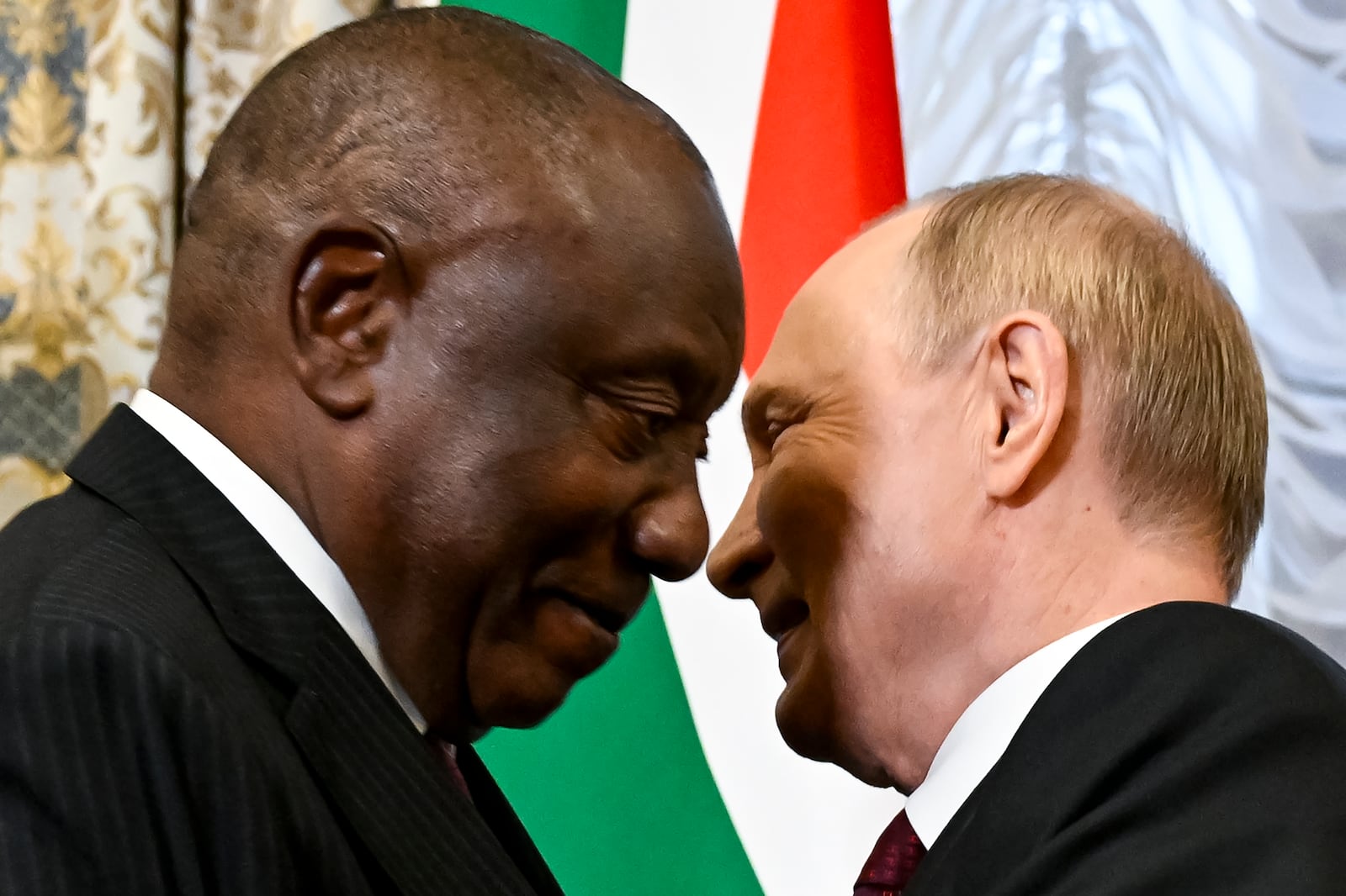 Russian President Vladimir Putin, right, embraces South African President Cyril Ramaphosa during their meeting on the sidelines of BRICS Summit at Kazan Kremlin in Kazan, Russia, Tuesday, Oct. 22, 2024. (Alexander Nemenov, Pool Photo via AP)