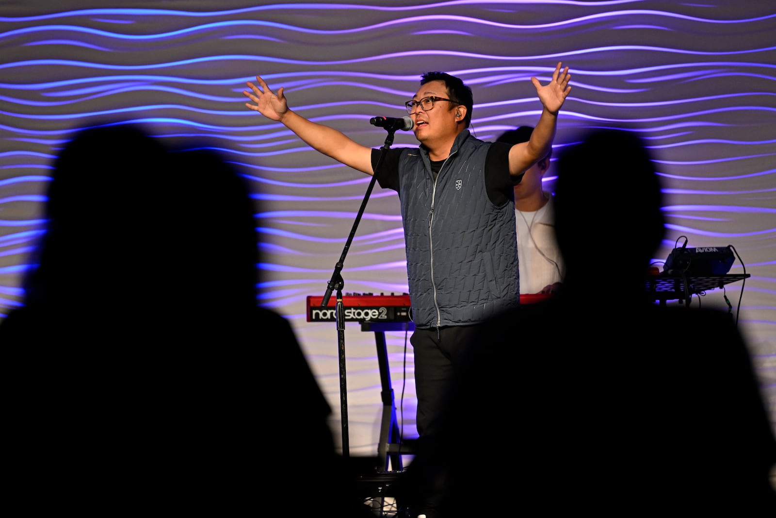 Sun Young sings during a service at the Christ Central Presbyterian Church, Sunday, Oct. 13, 2024 in Centreville. (AP Photo/John McDonnell)