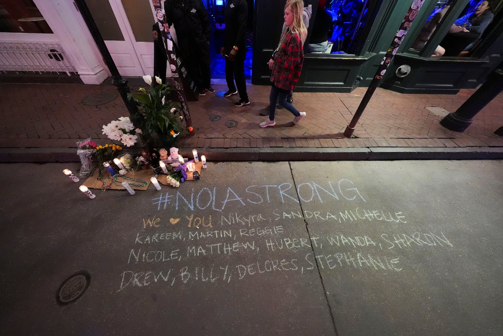 A memorial on Bourbon Street is seen at the site of a deadly truck attack on New Year's Day in New Orleans, Friday, Jan. 3, 2025. (AP Photo/Gerald Herbert)