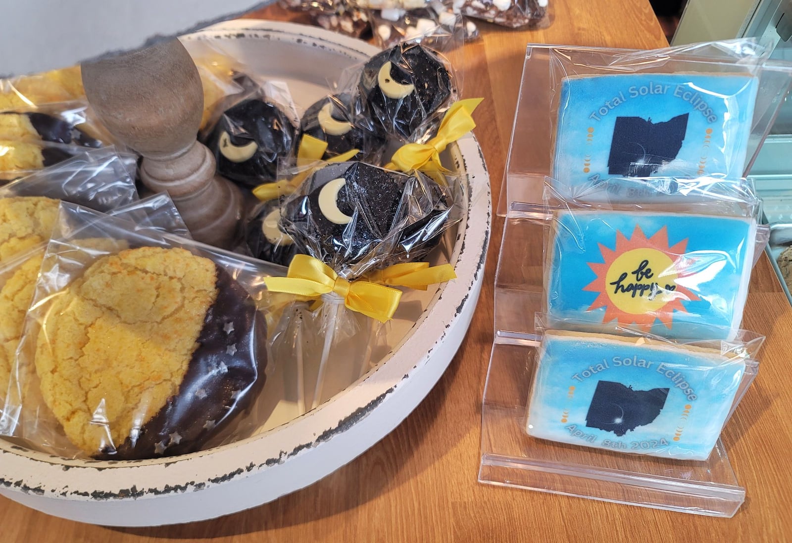 Many businesses in the area have eclipse merchandise like these custom cookies at Luke's Custom Cakes in Hamilton. NICK GRAHAM/STAFF