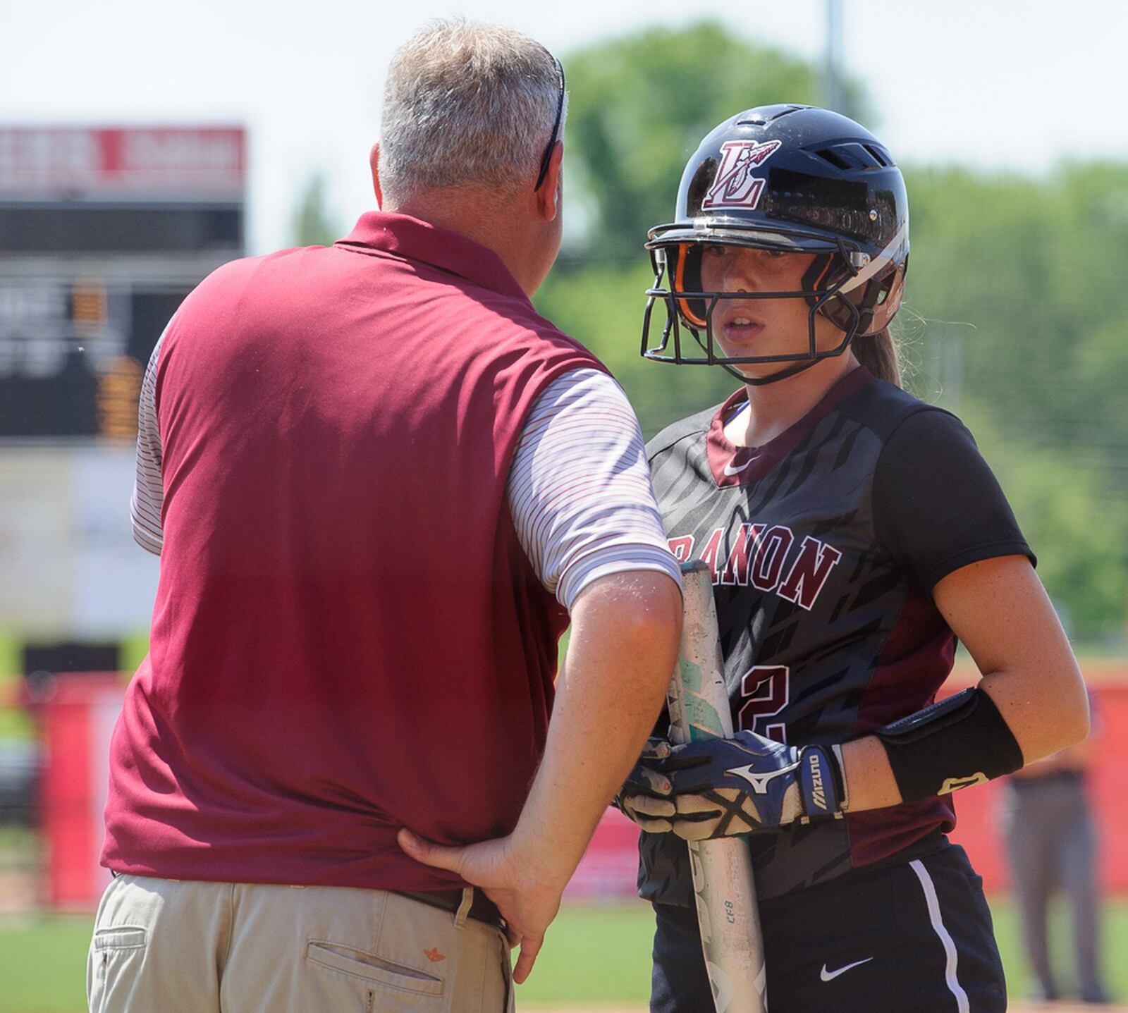 Lebanon’s Kat Frank listens to instructions from Warriors coach Brian Kindell during Saturday’s Division I state final against Elyria at Firestone Stadium in Akron. CONTRIBUTED PHOTO BY BRYANT BILLING