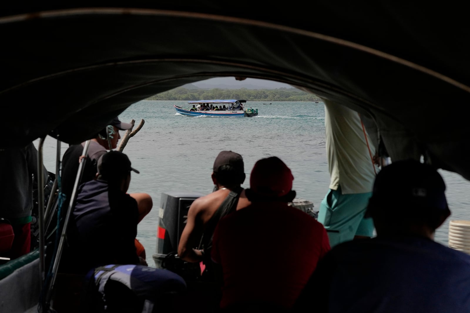 Venezuelan migrants depart Panama's Caribbean coastal island of Sugdub Gardi for Colombia, Sunday, Feb. 23, 2025, after turning back from southern Mexico where they gave up hopes of reaching the U.S. amid President Trump's crackdown on migration. (AP Photo/Matias Delacroix)